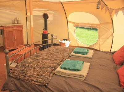 The inside of a comfortable glamping tent