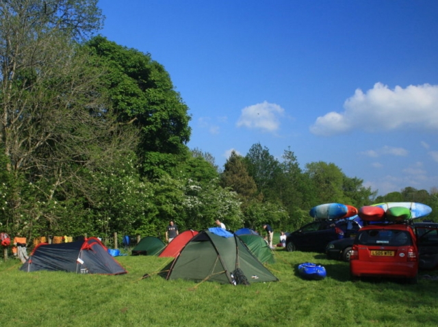 kayak group camping on the traditional camping field at Tyn Cornel campsite